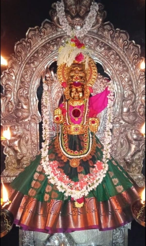 Speck of dust at the feet of Devi